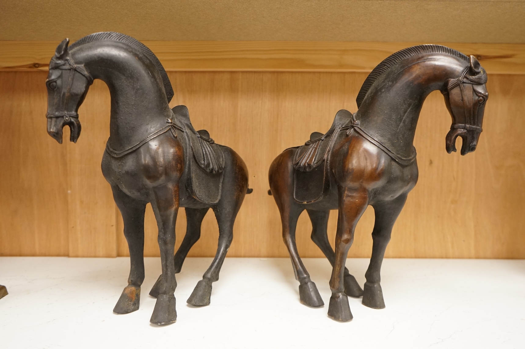 A pair of modern bronze figures of Tang horses, 30cm high